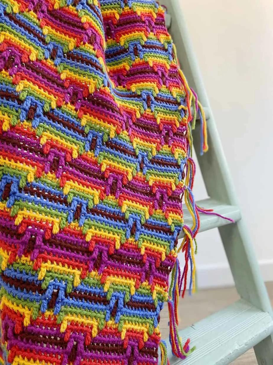 beginner mosaic crochet blanket over ladder