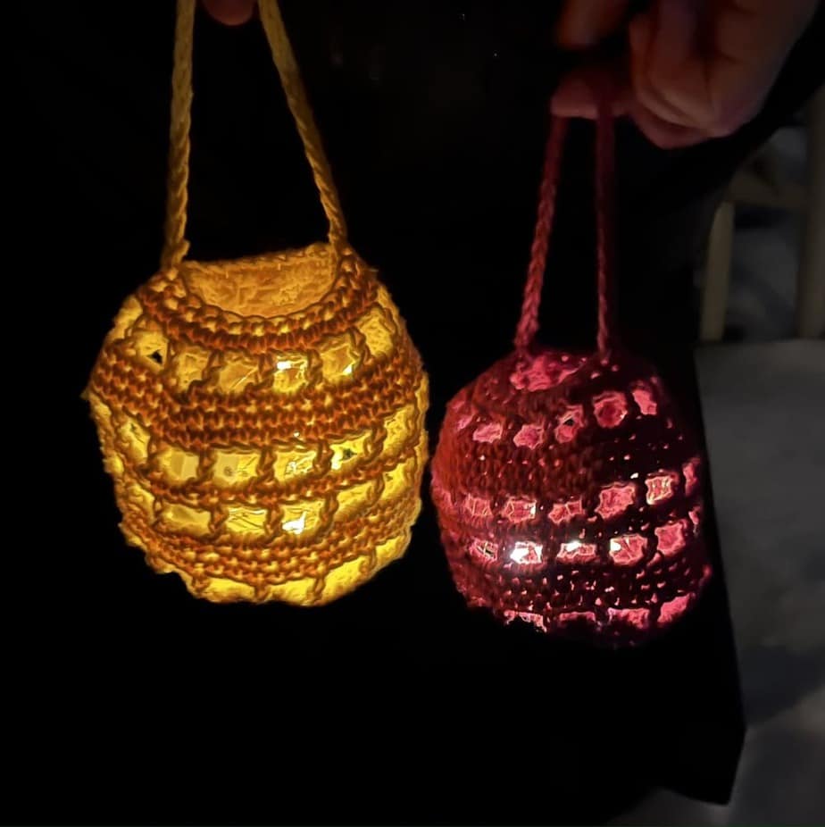 Crochet lanterns lit up at night.