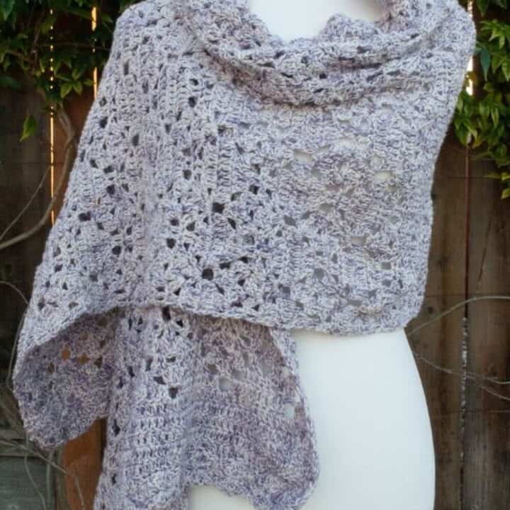 Gray wrap on a dress form.