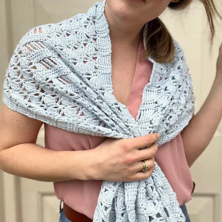 Gray wrap around woman's shoulders.