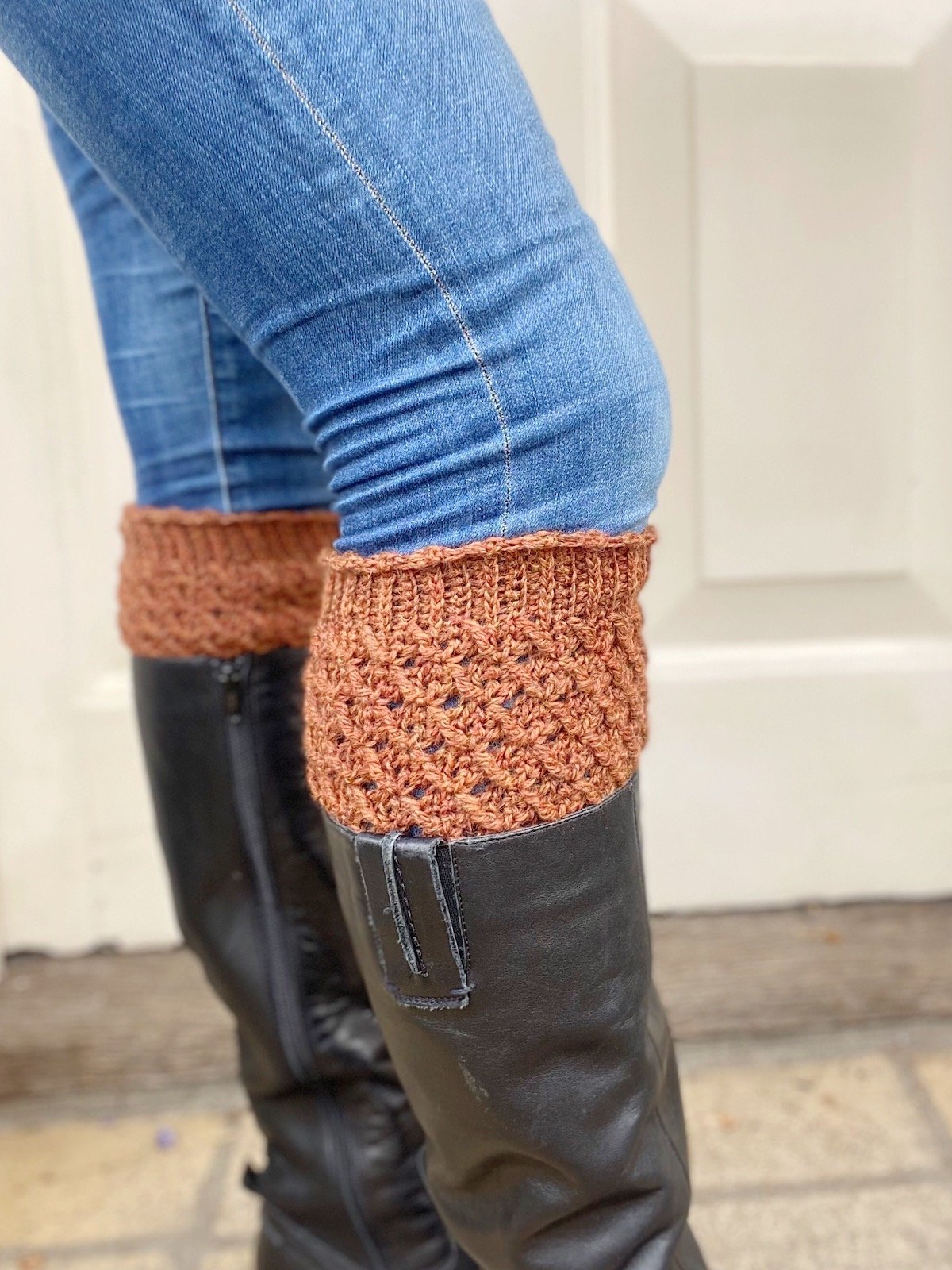 close up of tweed crochet leg warmer with knee high boots