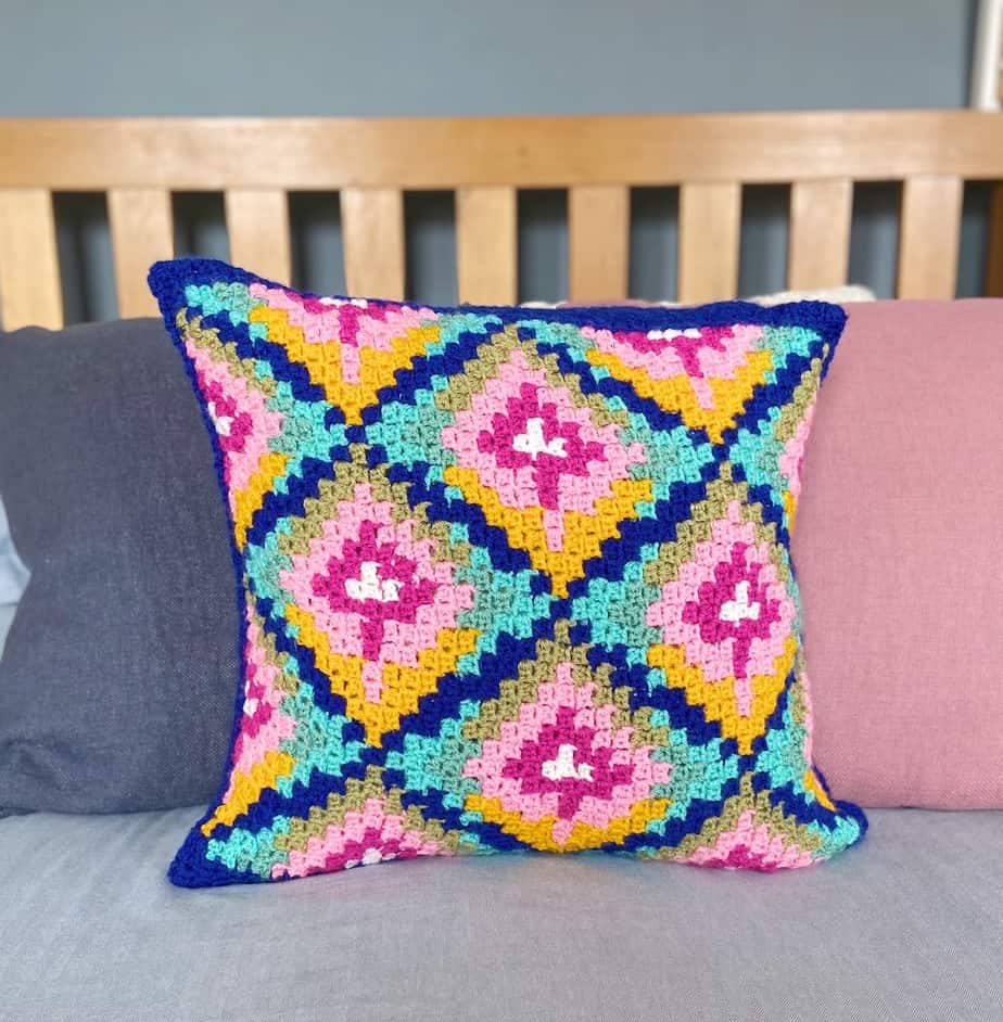colourful crochet cushion with geometric floral design