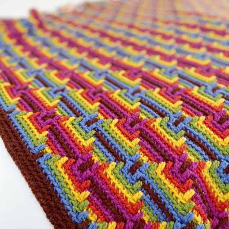 Colourful diamond overlay mosaic crochet blanket.