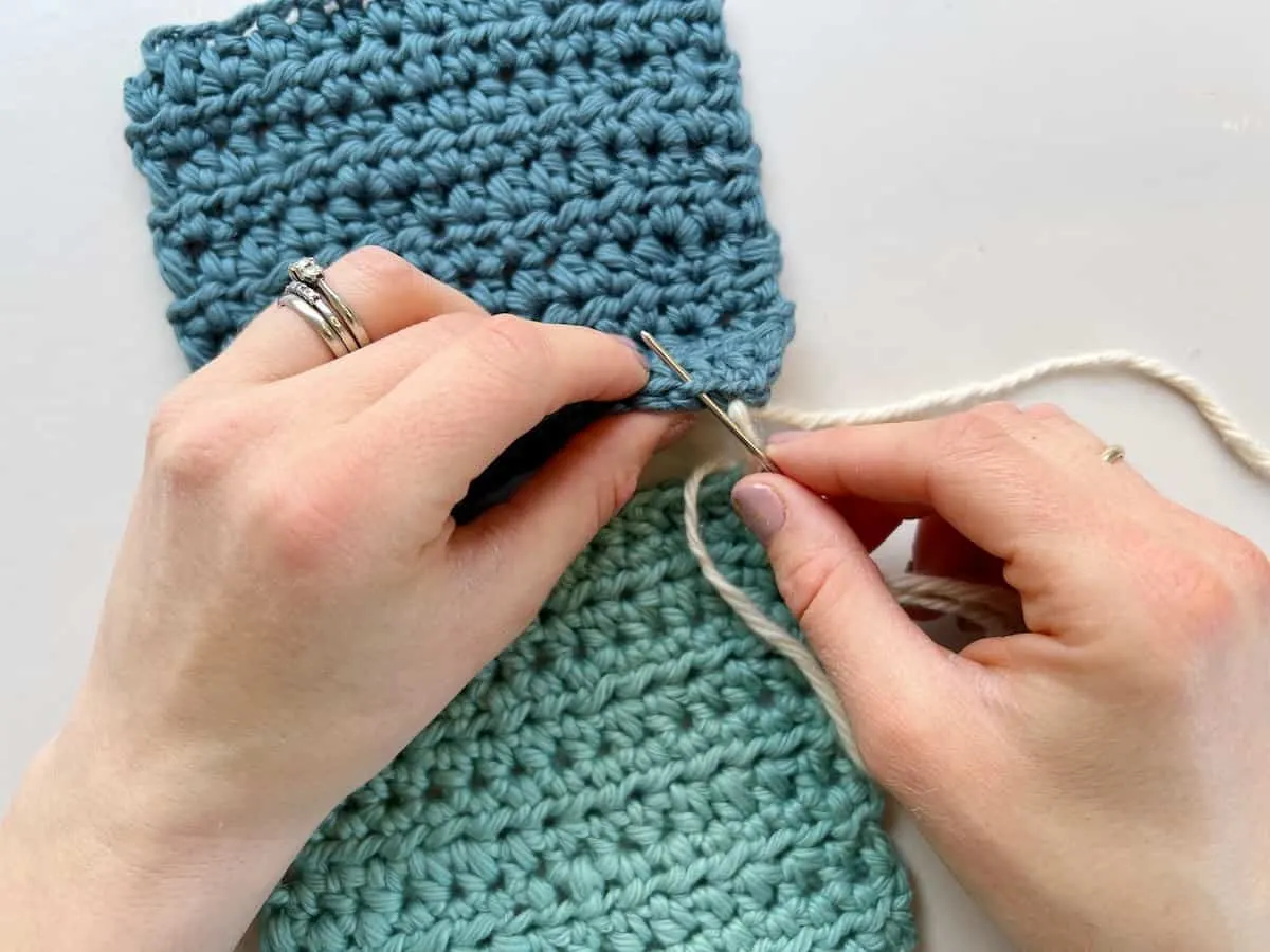 inserting needle into stitch of crochet