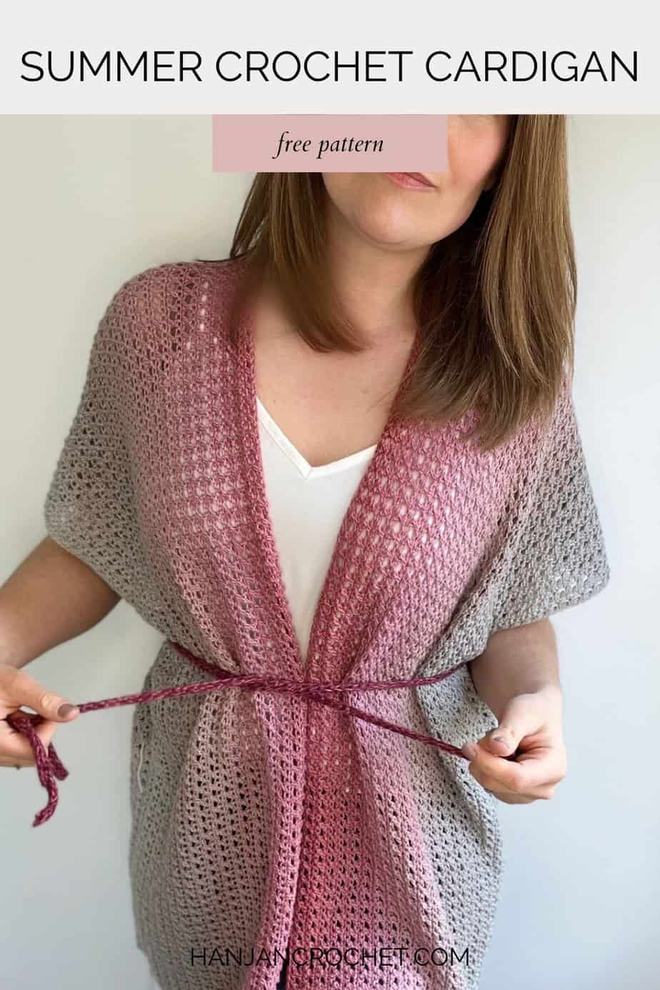 Woman wearing light crochet cardigan pattern with tie at the waist.