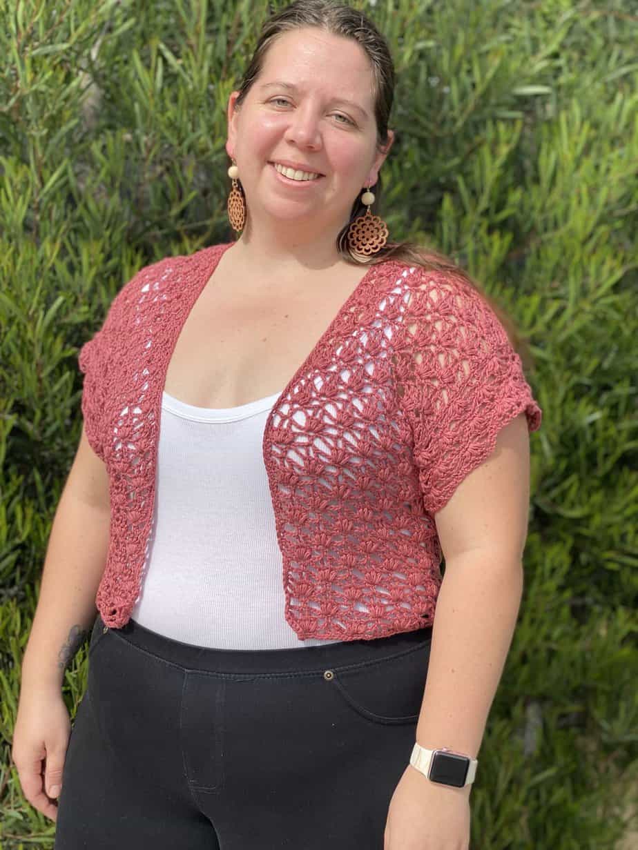 Lacy crochet coverup cardigan pattern on plus size model.