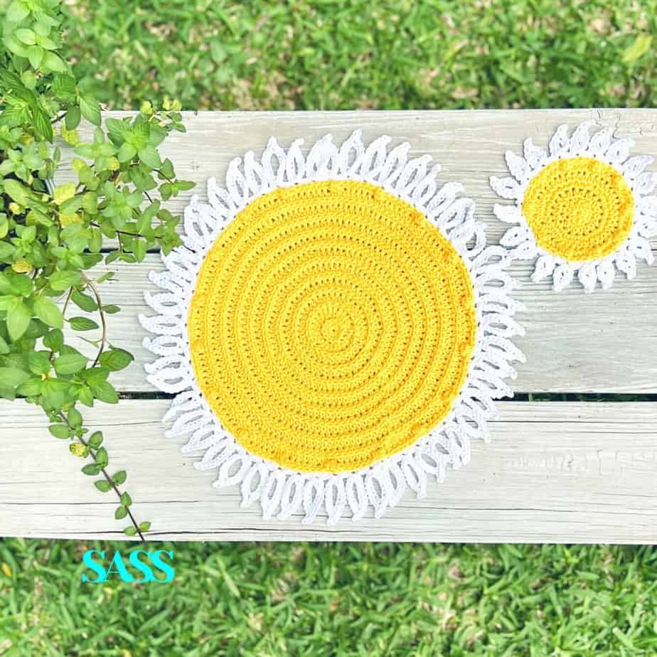 Daisy crochet placemat pattern in yellow and white with matching coaster.