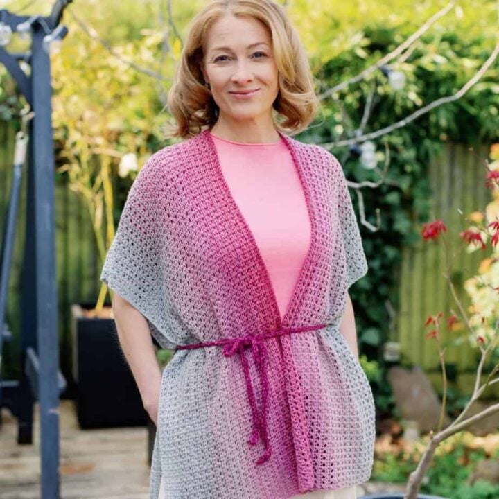 Woman wearing lightweight crochet cardigan pattern for summer.
