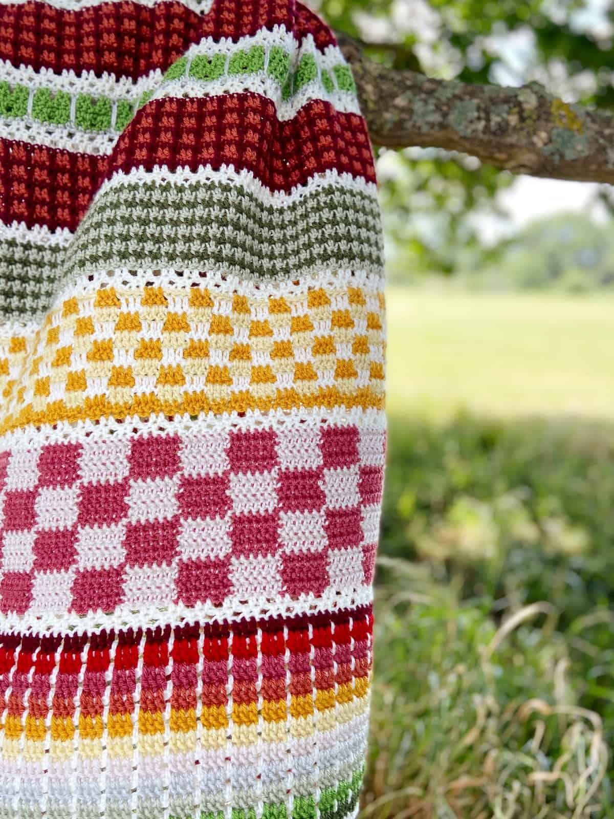 Close up of colorful crochet blanket pattern.