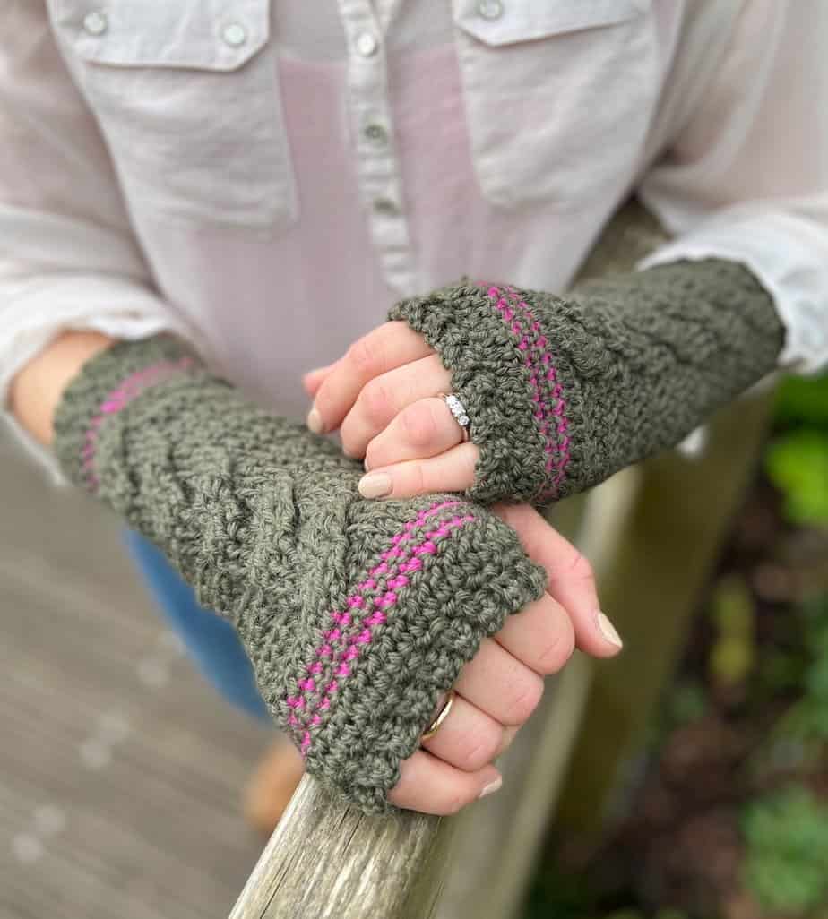 Woman wearing crochet cable glove pattern.