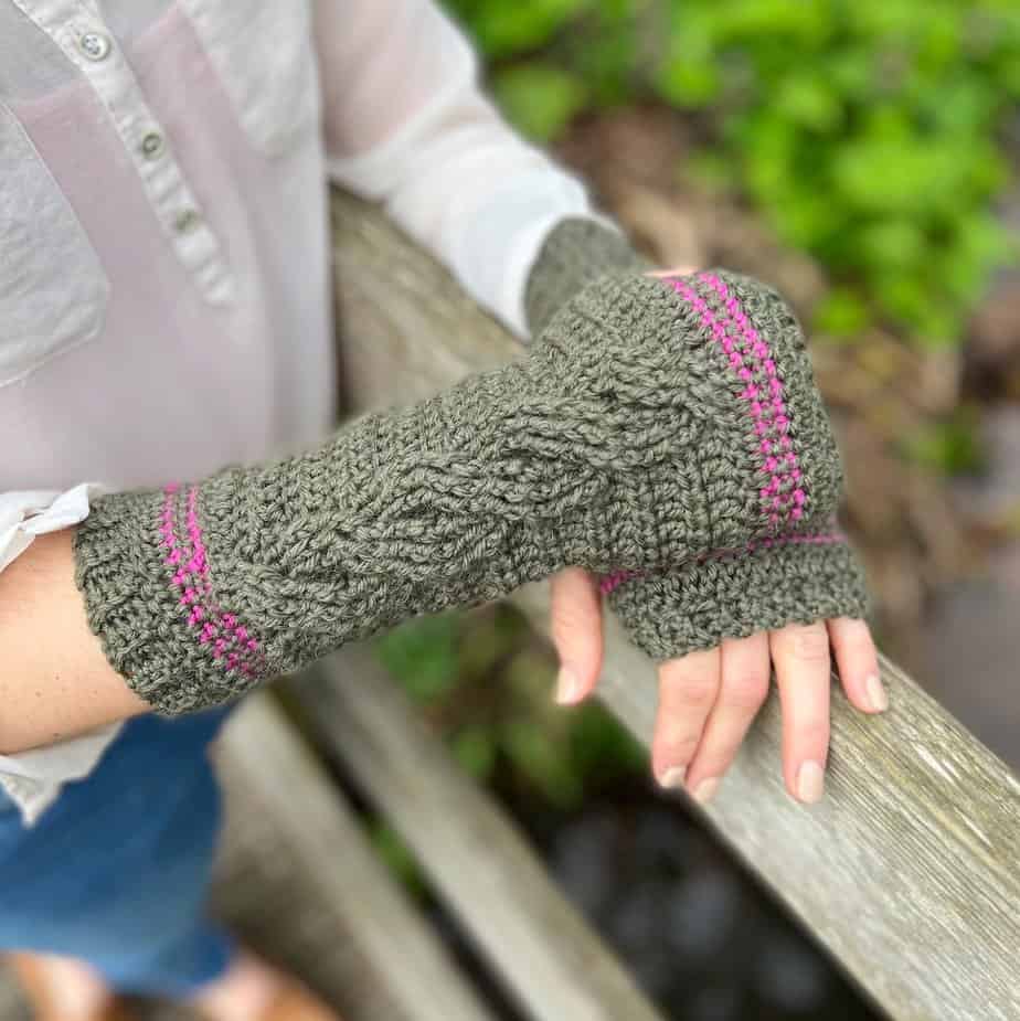 Cable crochet wrist warmer pattern in green.