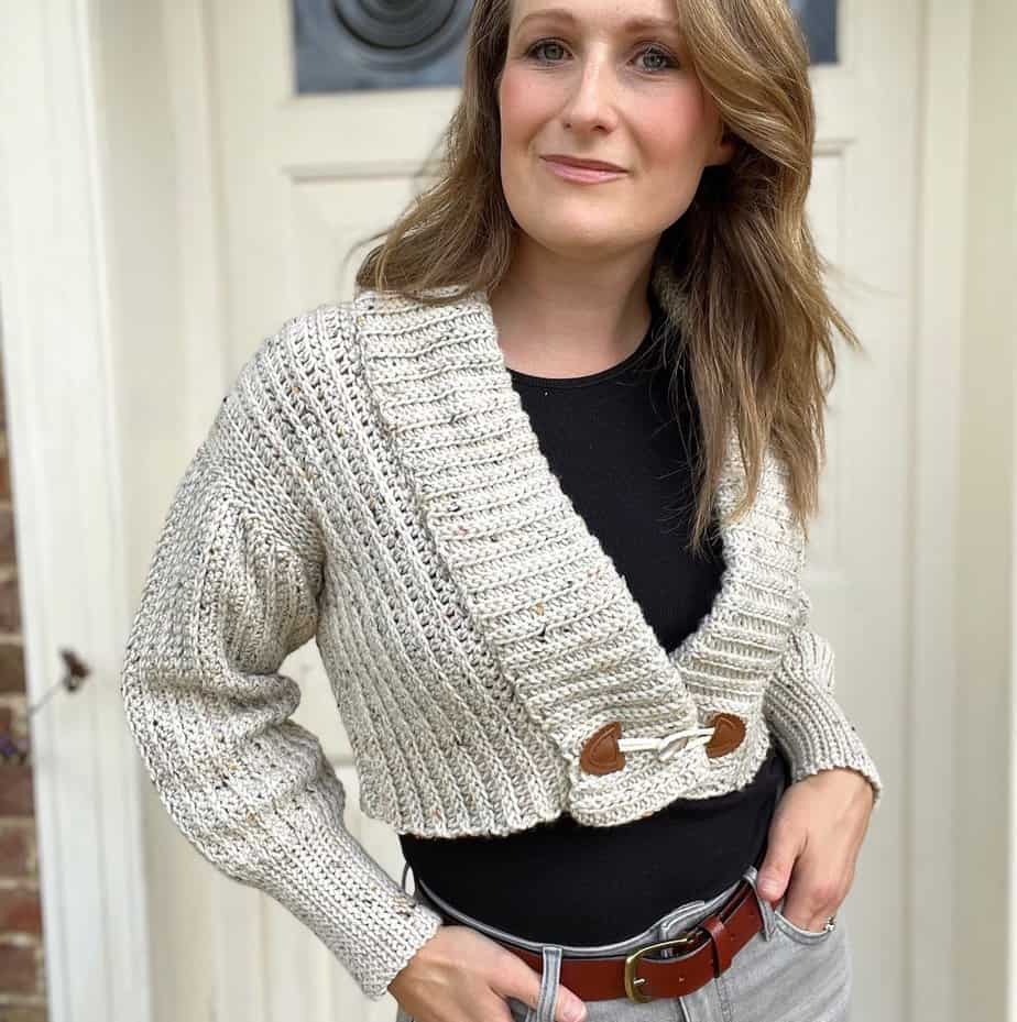 Crop crochet cardigan pattern in tweed yarn.