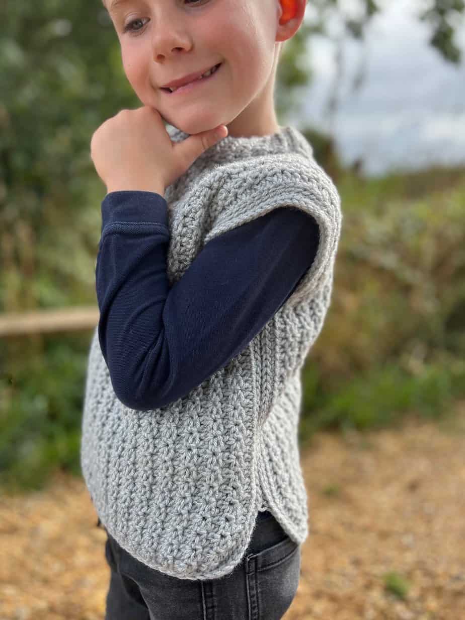 Child wearing easy crochet pullover pattern.