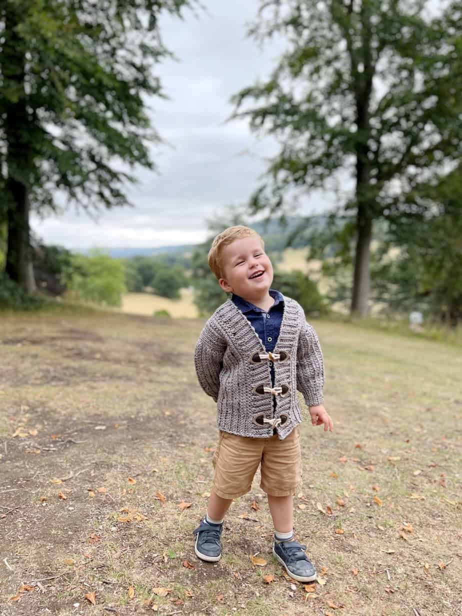 Toddler wearing crochet cardigan for baby boy.