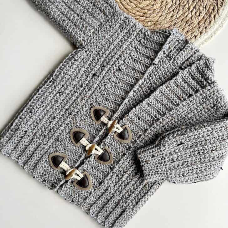 Child crochet cardigan pattern with toggles.