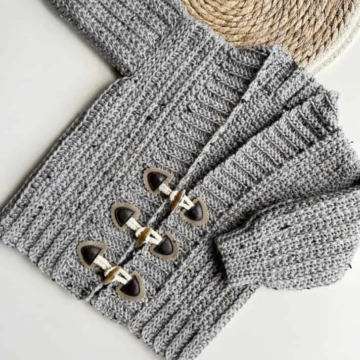 Child crochet cardigan pattern with toggles.
