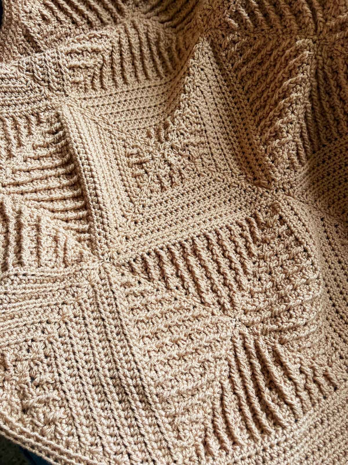Textured crochet blanket using corner to corner crochet squares.