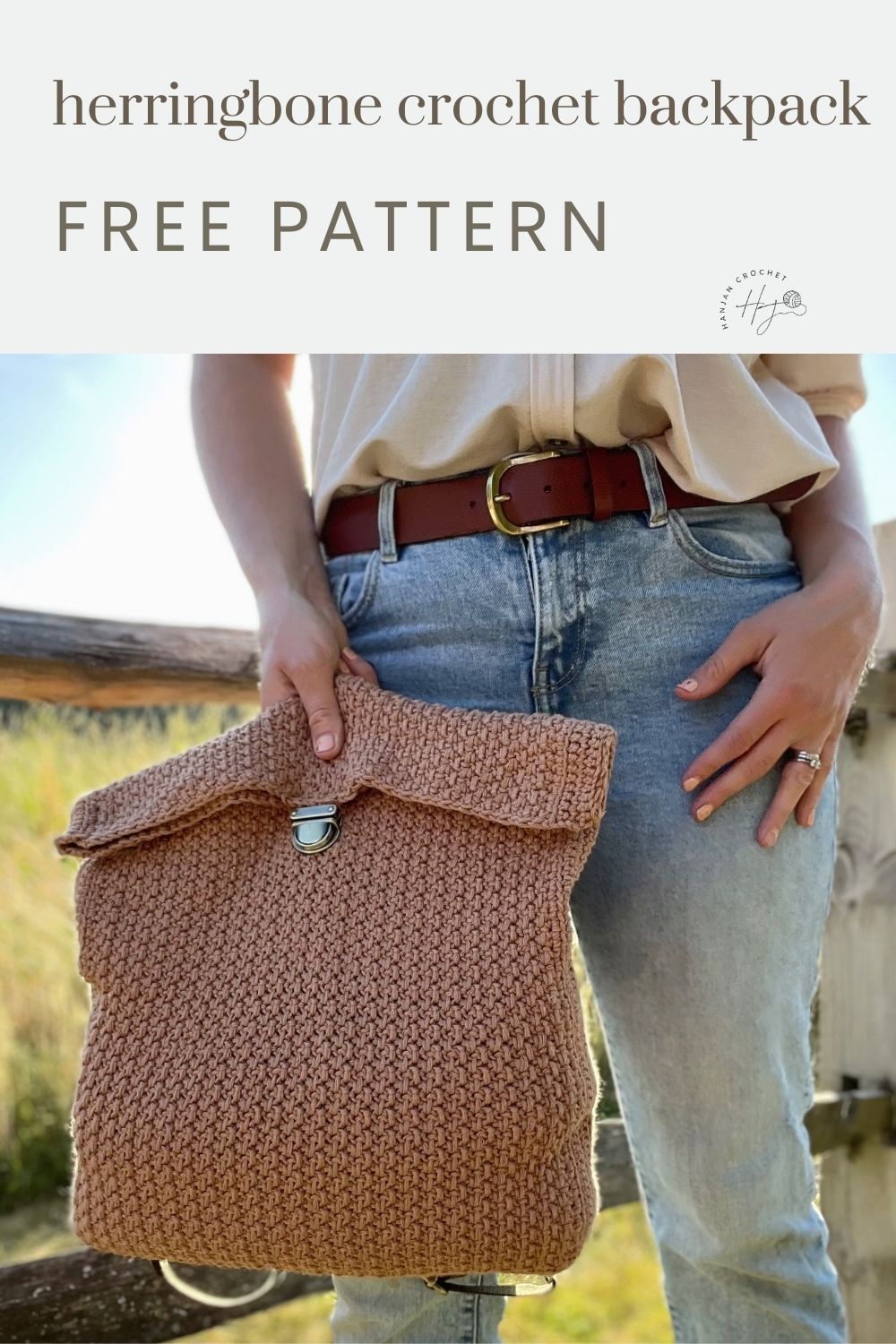 Person holding a handmade crochet backpack in a natural outdoor setting; text above reads "herringbone crochet backpack FREE PATTERN – discover this unique crochet backpack pattern.