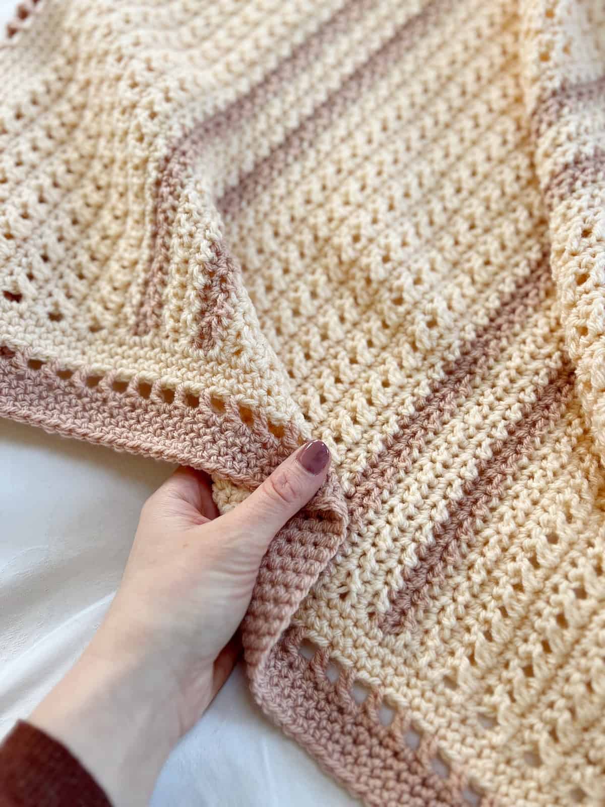 Close up of subtle stripe baby crochet blanket pattern.