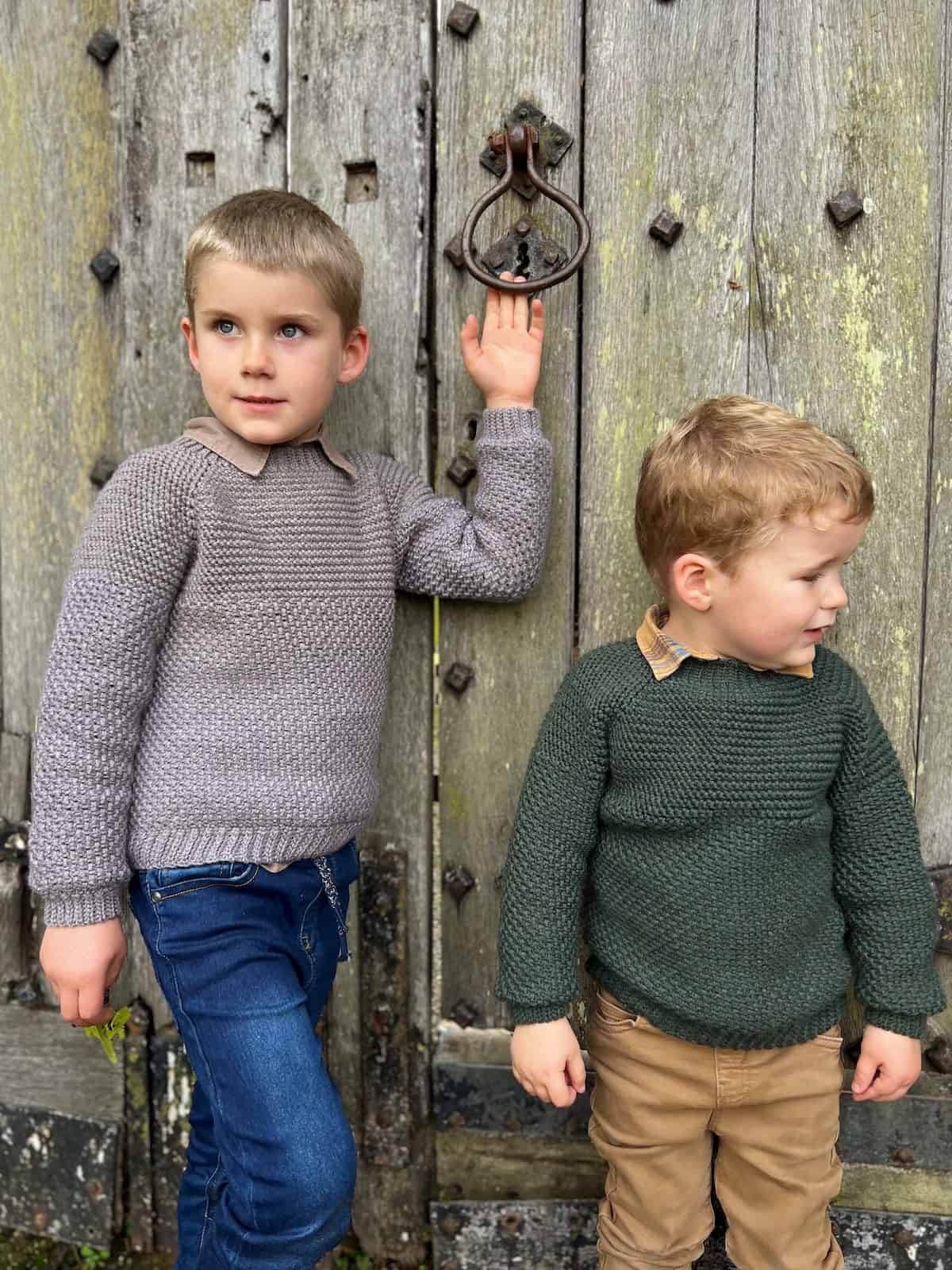Crochet sweater pattern for boys and girls on a toddler and 5 year old boy in grey and green.