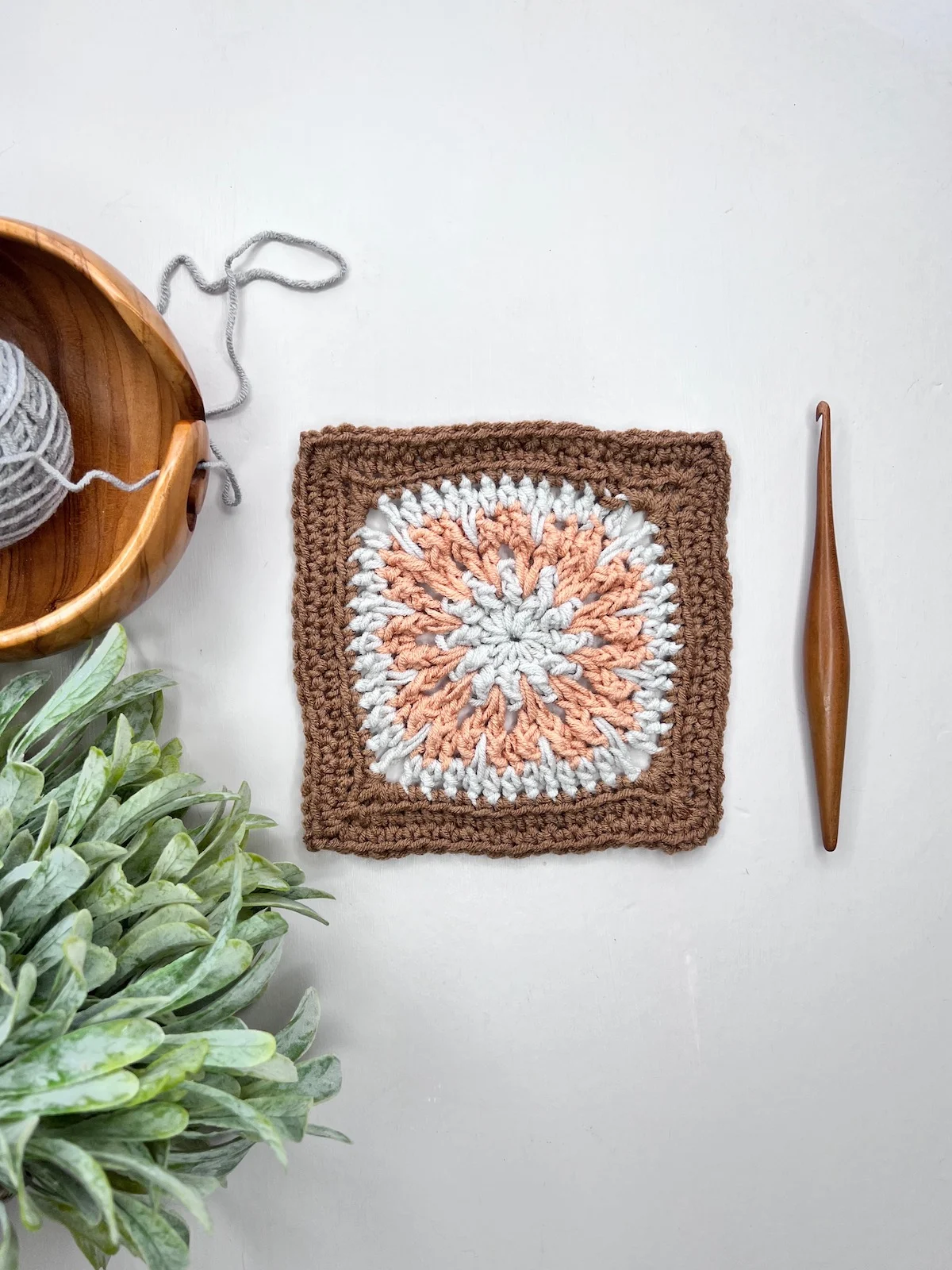 Textured crochet square pattern.