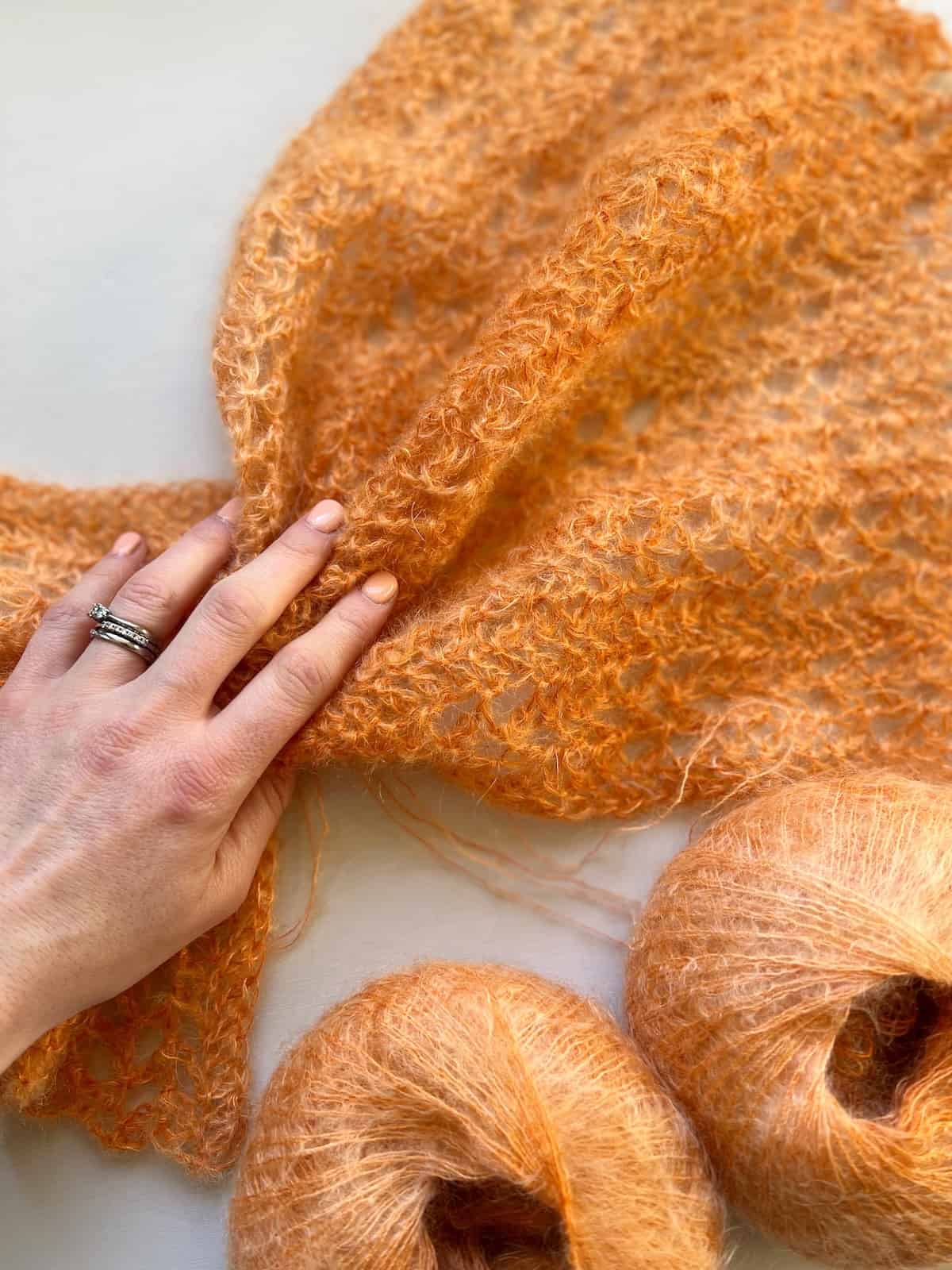 Orange crochet scarf pattern with mohair yarn.