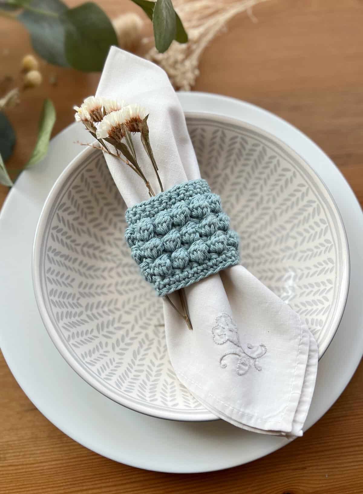 Easy crochet napkin ring set on a table.