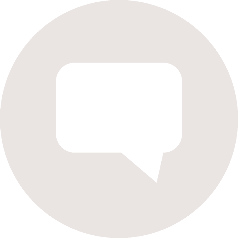 A black and white speech bubble icon in a circle.