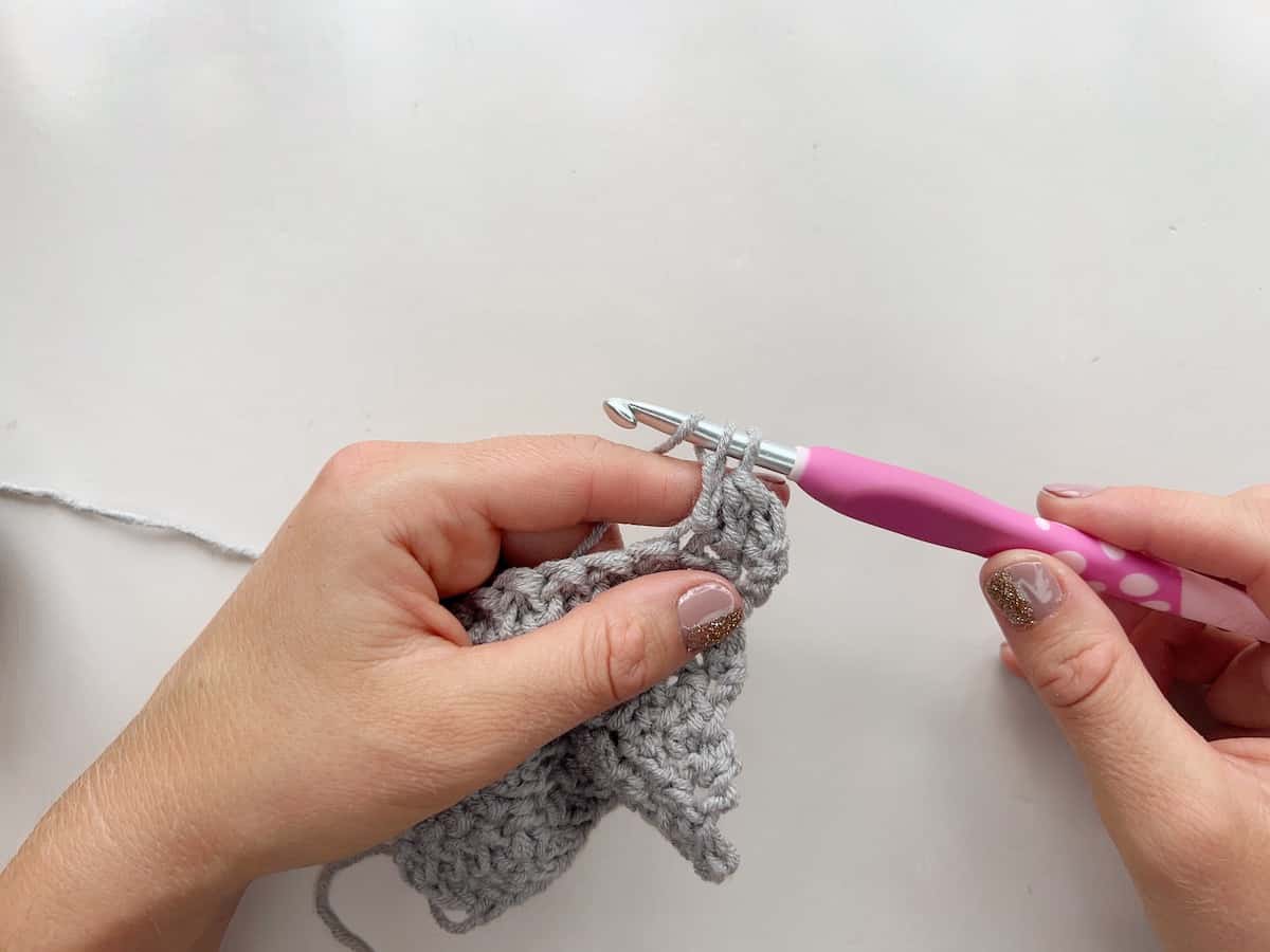 Herringbone double crochet stitch step 8 yarn over and pull through 2 loops