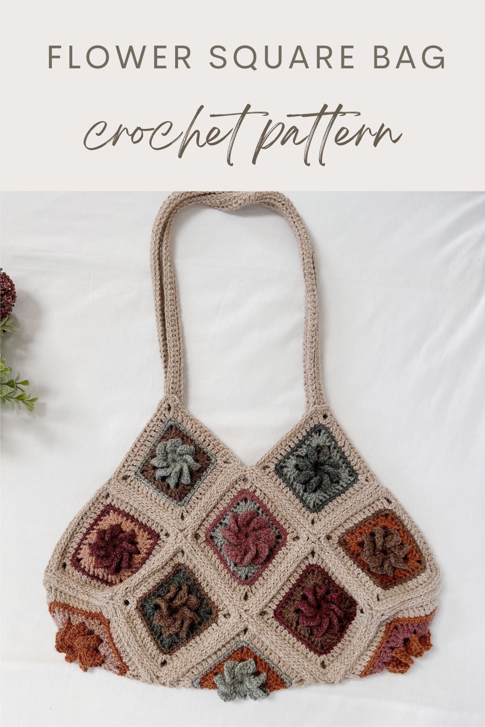 A Granny Square Bag Crochet pattern featuring a double strap and multicolored floral squares on a light background, laid flat on a white surface. Text above reads "Flower Square Bag Crochet Pattern.
