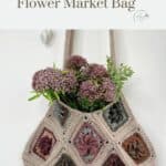 A crocheted Granny Square bag with multicolored floral square motifs is filled with purple and green flowers, hanging against a white background. Text above reads, "Free Crochet Pattern Flower Market Bag.