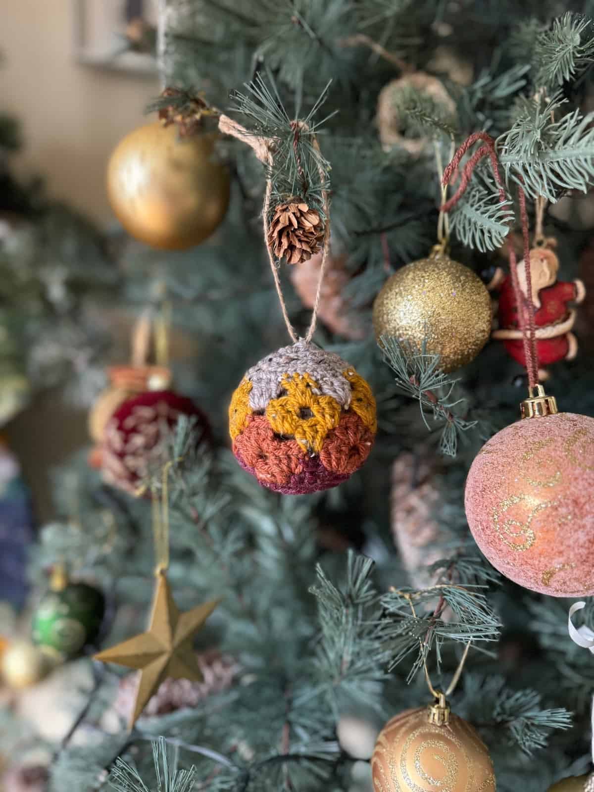 Christmas ornaments hanging on a christmas tree.