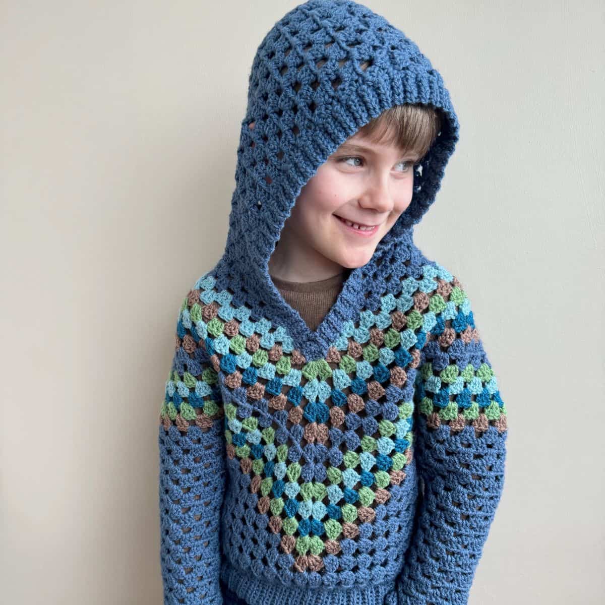 A child wearing a blue hoodie.