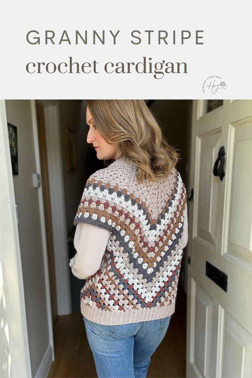 Woman showcasing a handmade granny stripe crochet cardigan.