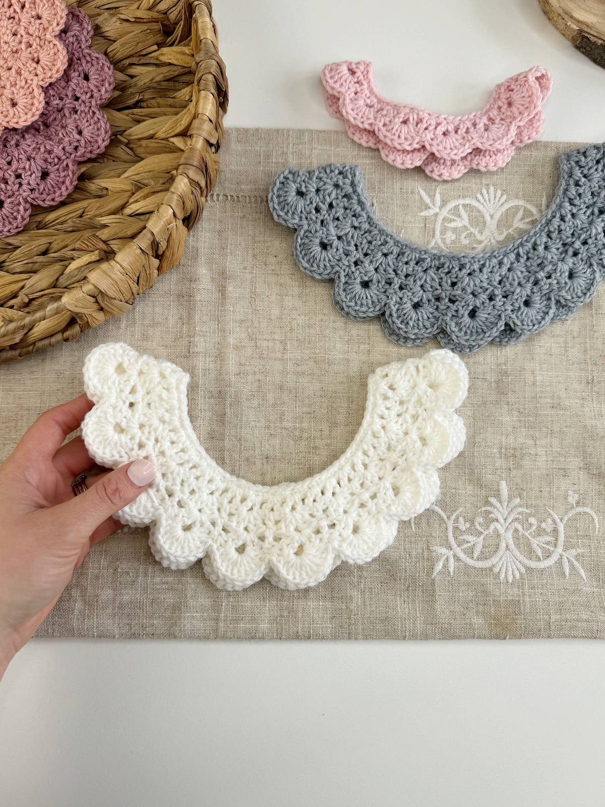 Two crocheted collars on a table.