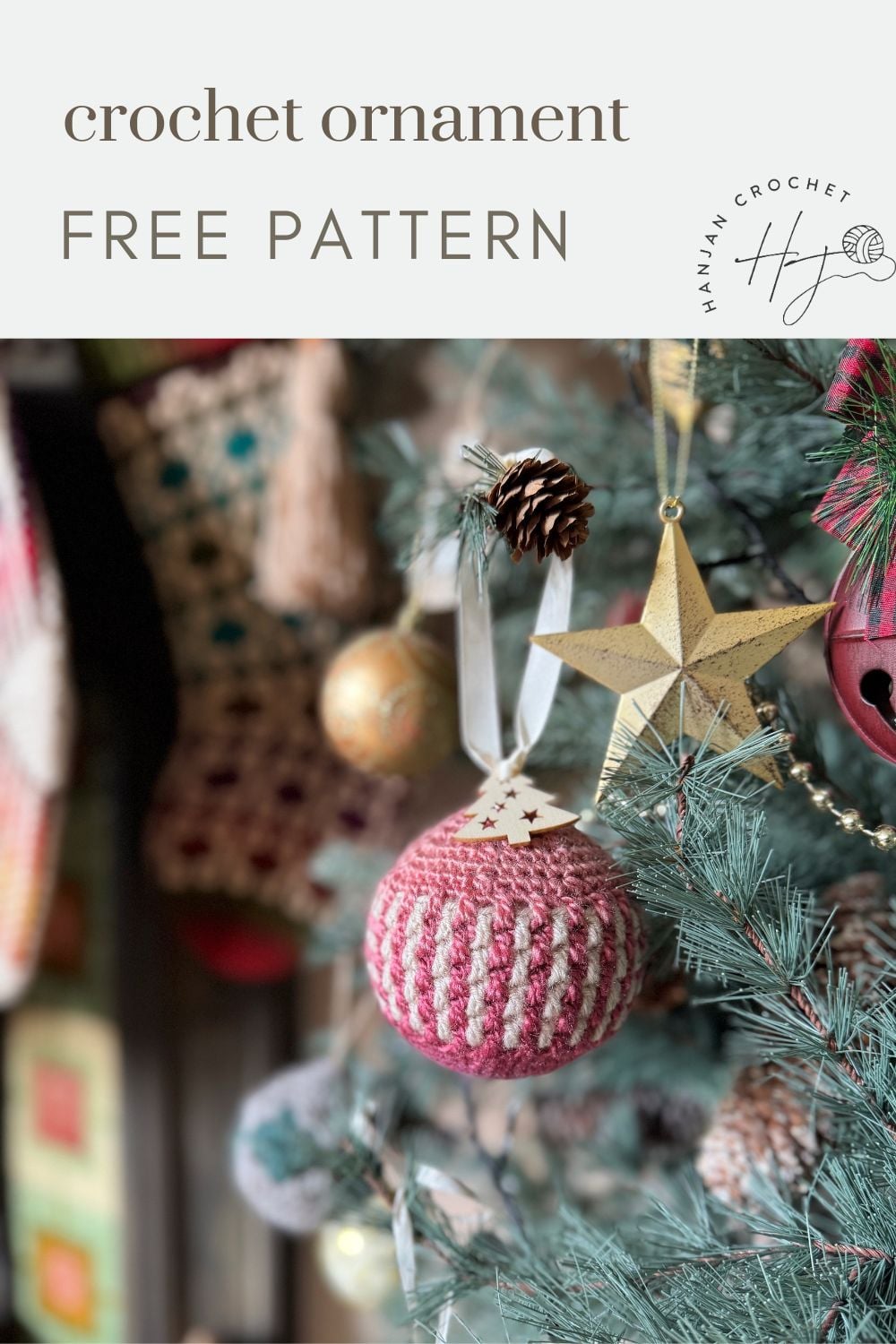 Close-up of a Christmas tree adorned with crochet tree decorations, including a red and white crocheted ornament, a gold star, and pine cone. Text reads "crochet ornament FREE PATTERN.