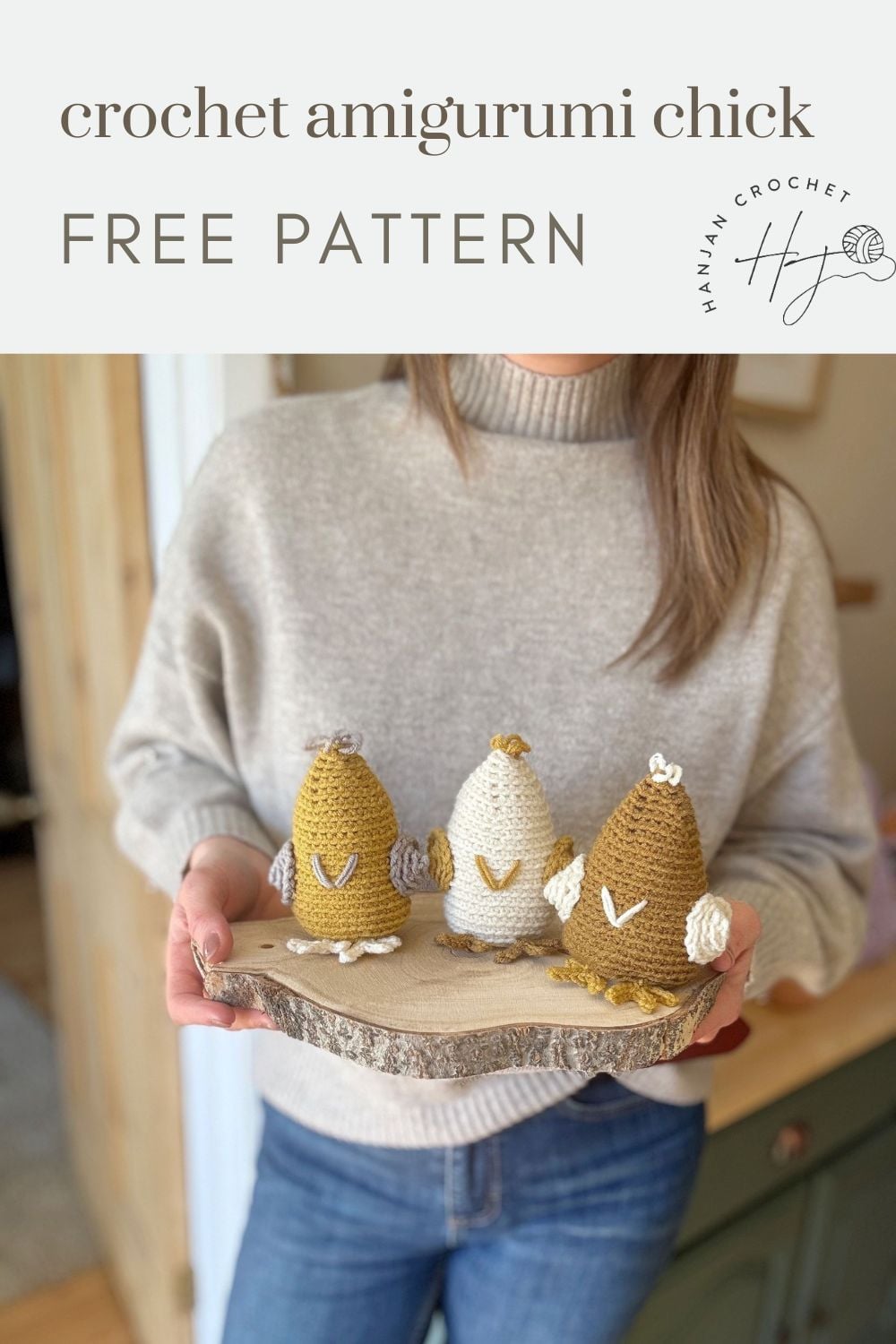 A person holds a wooden tray with three crocheted amigurumi chicks in yellow, white, and brown. This cute crochet chicken pattern is labeled as free from "Hannah Crochet.
