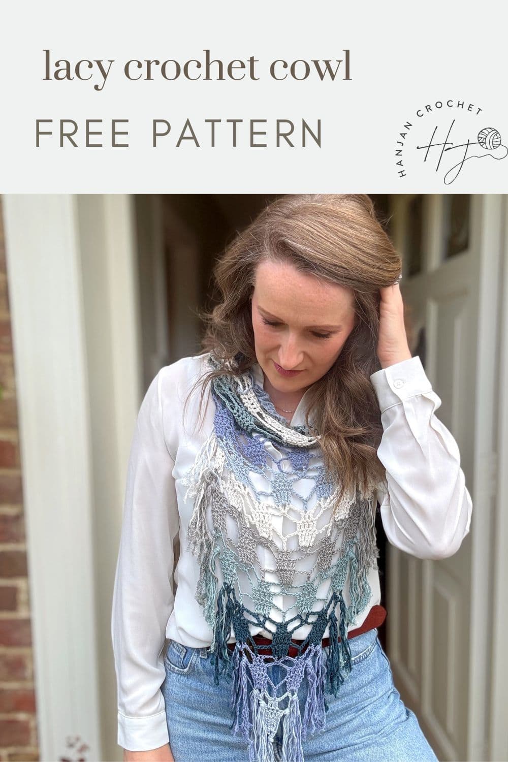 A woman wearing a white blouse and a lacy bandana scarf crochet pattern cowl stands outside a door, looking down. Text above reads "lacy crochet cowl FREE PATTERN.