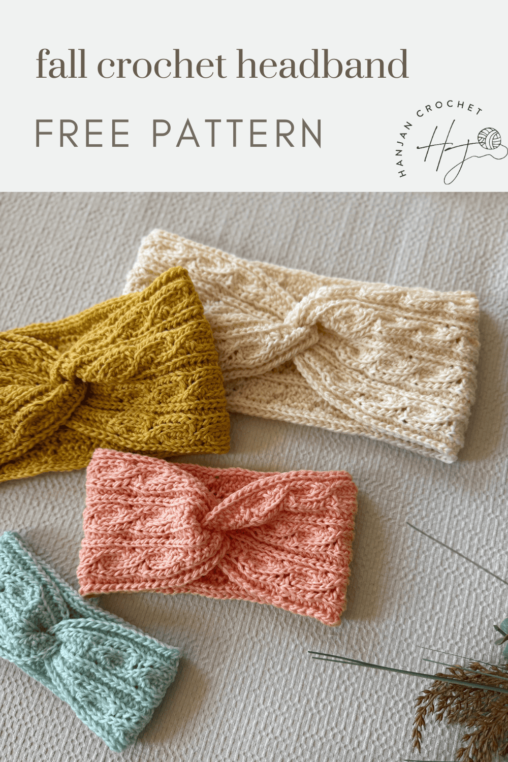 Four crocheted headbands in mustard yellow, cream, pink, and light blue are displayed on a textured surface with text reading "fall twisted crochet headband pattern FREE PATTERN.