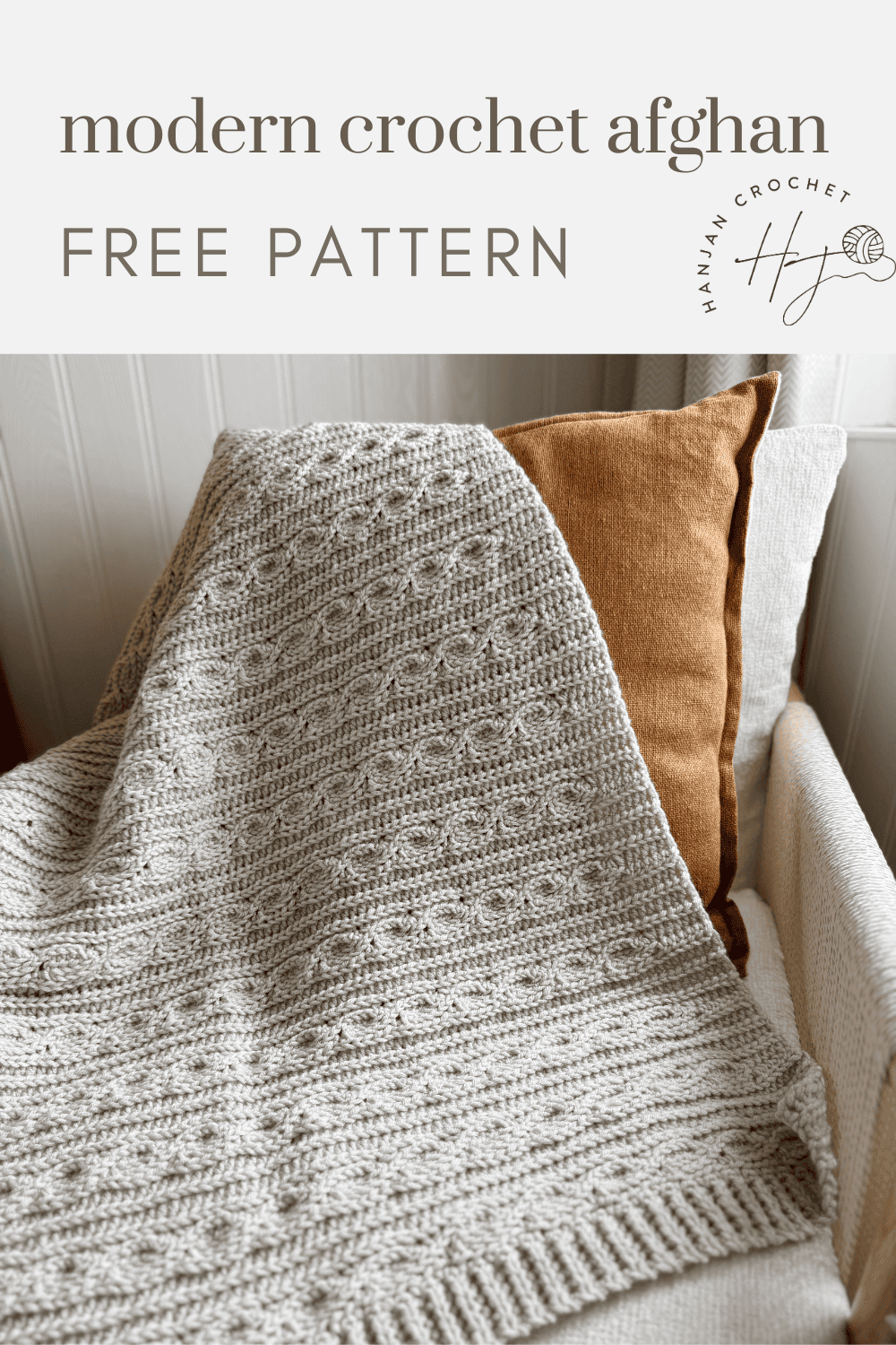 A textured, light gray crochet afghan is draped over a sofa with brown and white cushions. Text above reads: "modern crochet blanket pattern FREE PATTERN.