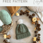 A green crochet hat with a fur pom-pom is displayed on a beige surface, surrounded by yarn, pumpkins, pinecones, and cushions. Text reads "puff stitch crochet hat pattern free.