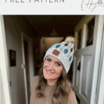 Woman wearing a beige and multicolored mosaic crochet beanie with a pom-pom, standing in a hallway. Text reads "seamless crochet hat FREE PATTERN.