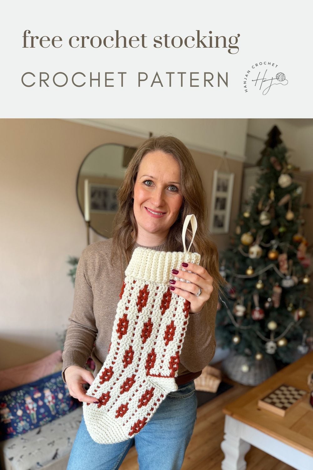 A woman stands in a living room holding a large crocheted stocking in front of a decorated Christmas tree. Text above reads "free crochet stocking crochet pattern" and shares tips on how to crochet a Christmas stocking.