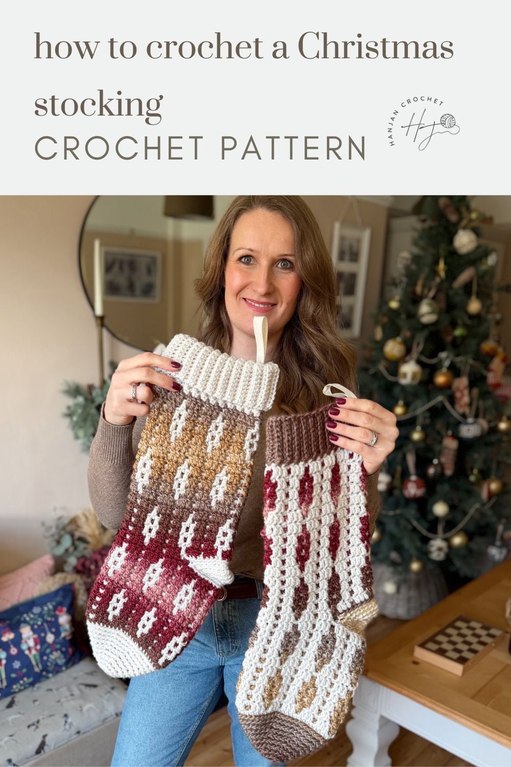 Woman holding two crocheted Christmas stockings in front of a decorated Christmas tree, with text above reading "how to crochet a Christmas stocking CROCHET PATTERN"—your guide for how to crochet a Christmas stocking this holiday season.