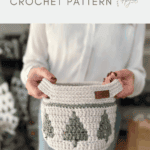 A person holds a handmade christmas crochet basket with a green tree pattern; text above reads "crochet storage basket CROCHET PATTERN.