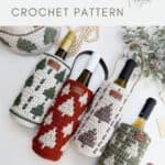 Four crochet wine bottle holders with geometric patterns in green, red, and cream colors, each holding a wine bottle, are displayed on a white surface.