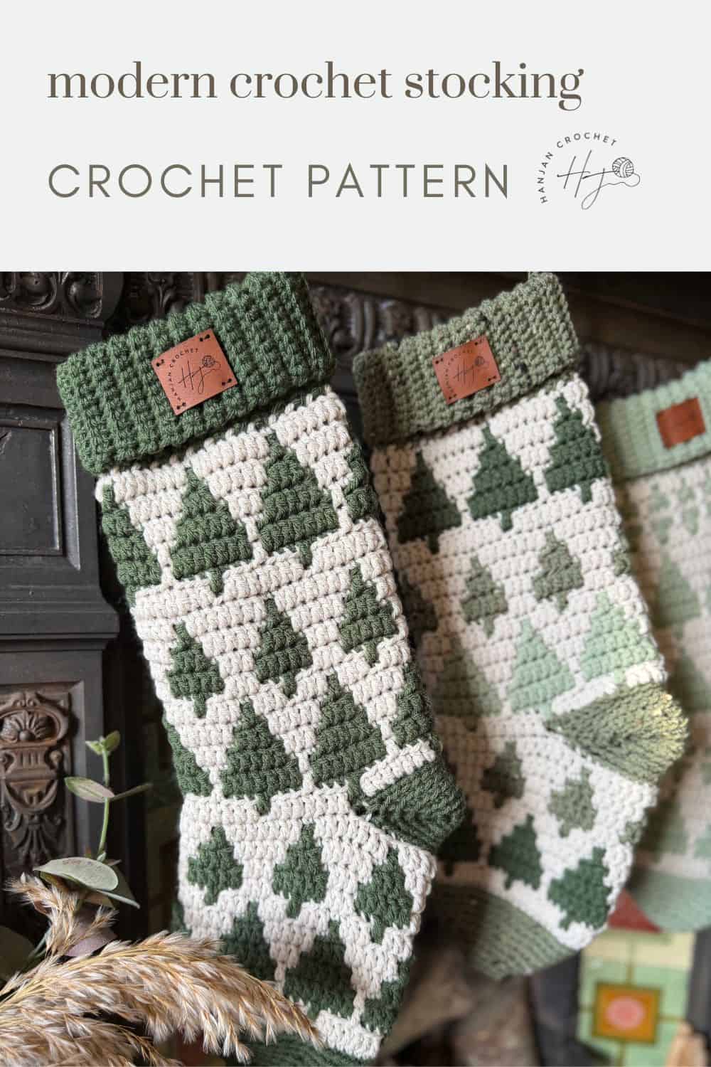 Two crocheted Christmas stockings with green tree patterns hang side by side, showcasing a modern crochet stocking pattern.