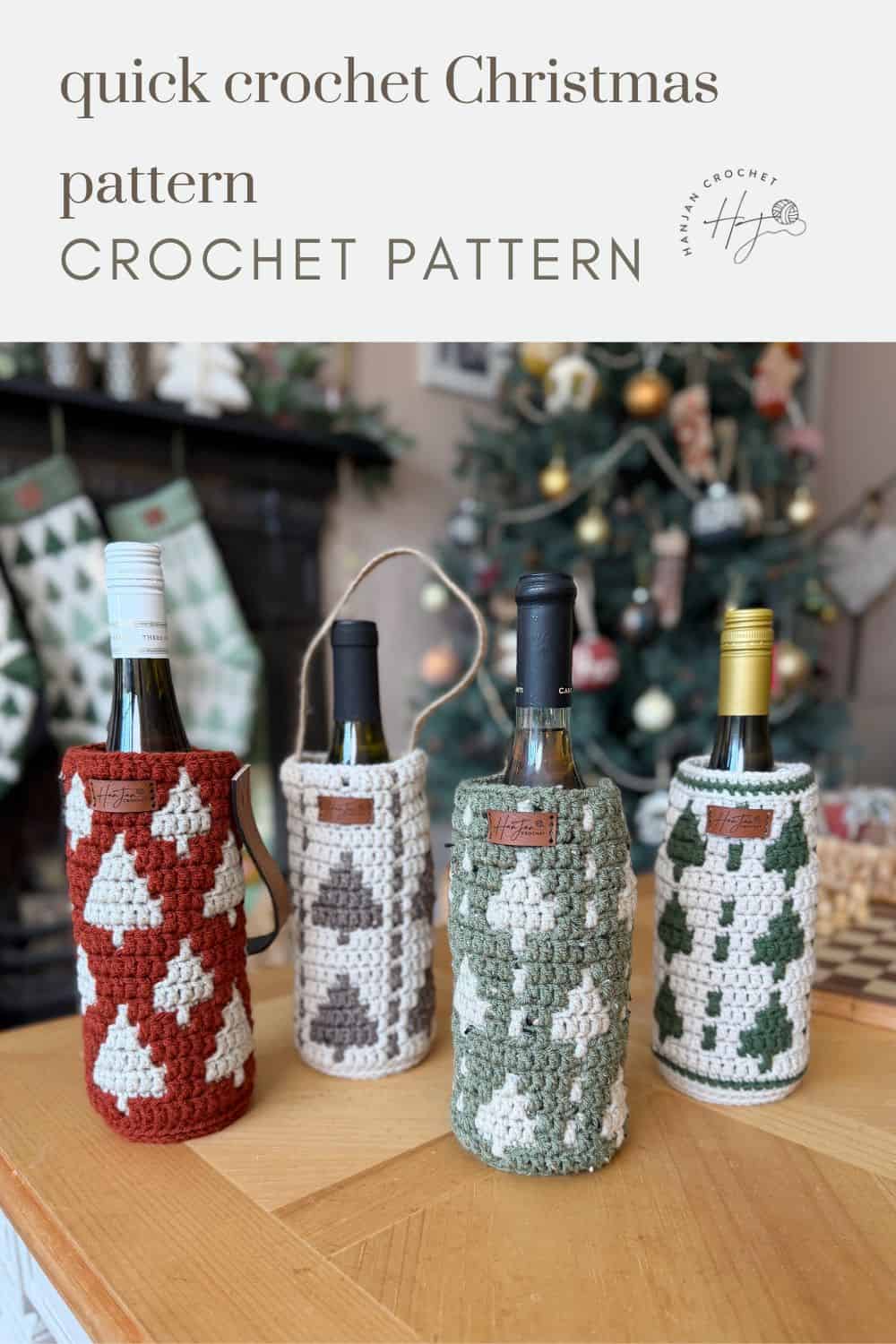 Four wine bottles in crochet wine bottle holders with Christmas tree patterns are displayed on a wooden surface, with a decorated Christmas tree and stockings in the background. Text reads "quick crochet Christmas pattern.