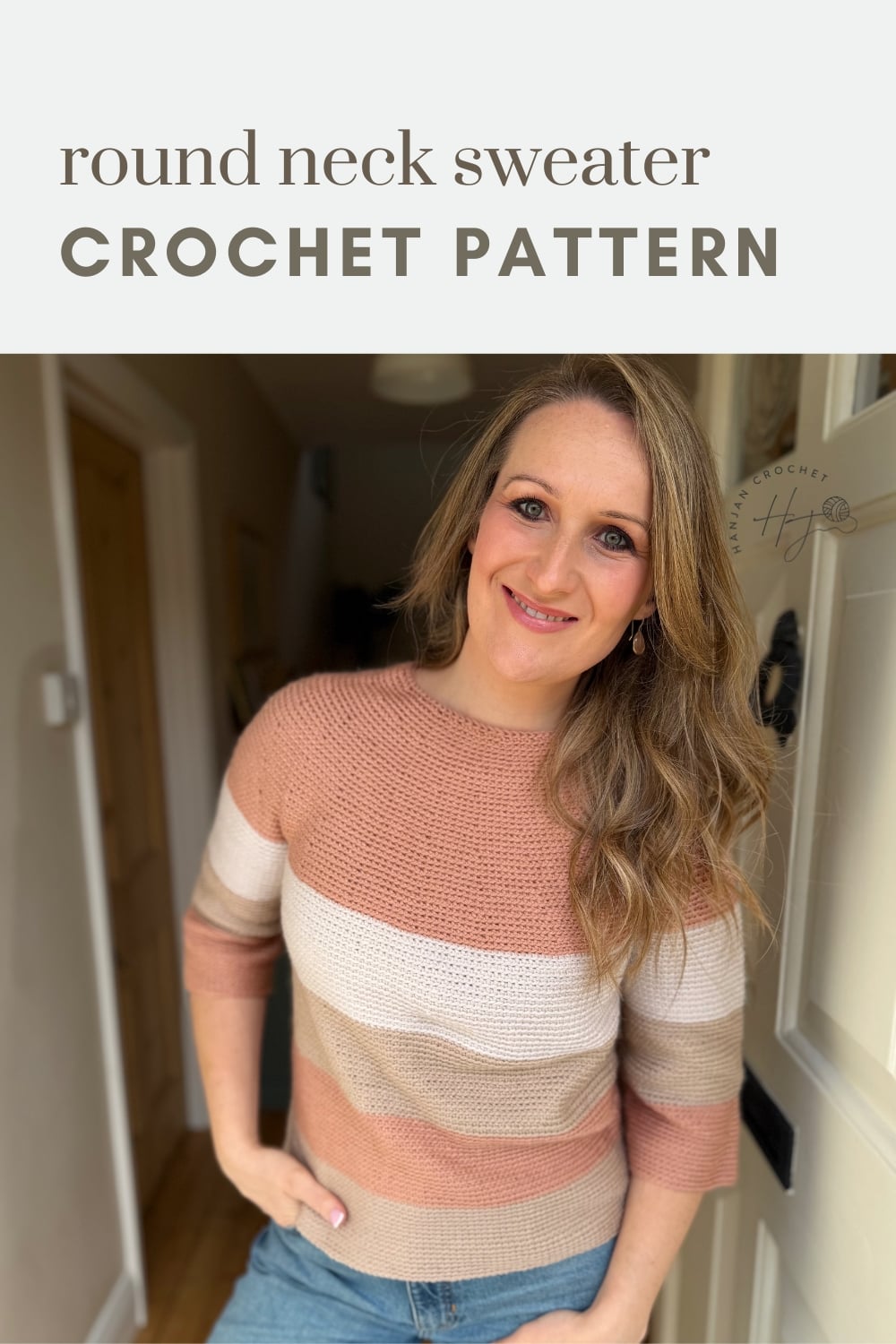 Woman wearing a striped, round neck crochet sweater stands indoors, smiling at the camera. Text above reads "round neck sweater CROCHET PATTERN.