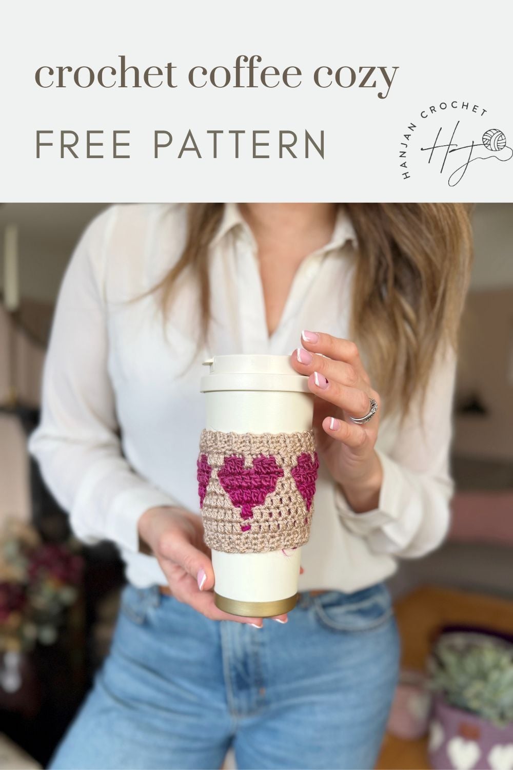 Woman holding a coffee cup wrapped with a pink and beige crochet coffee cozy with heart detail; "crochet coffee cozy free pattern" text above.